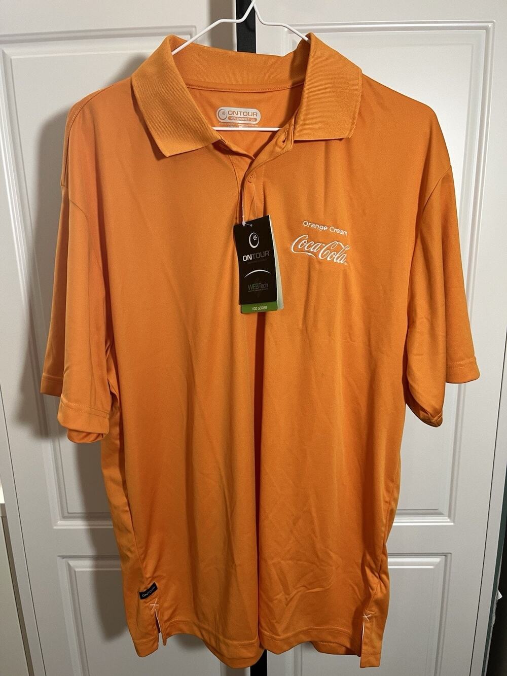 Ontour Men’s 100 Series Coca-Cola Orange Cream SS Golf Shirt LG